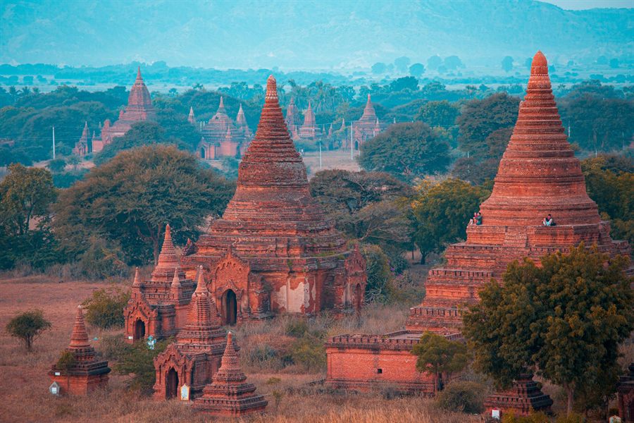 Red-brick temples and stupas rising above the trees at Bagan, Myanmar